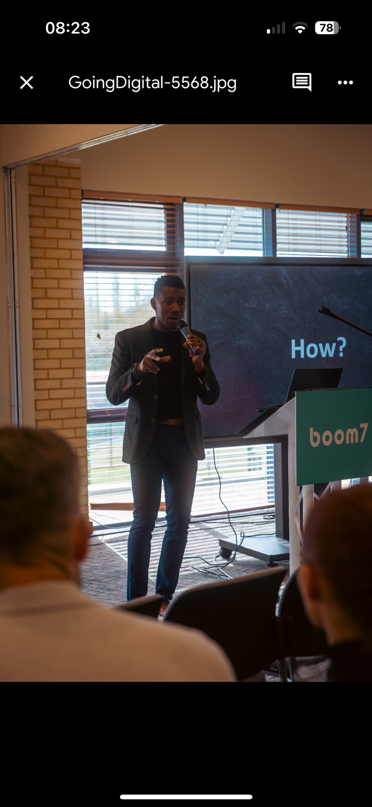 John presenting to a large room