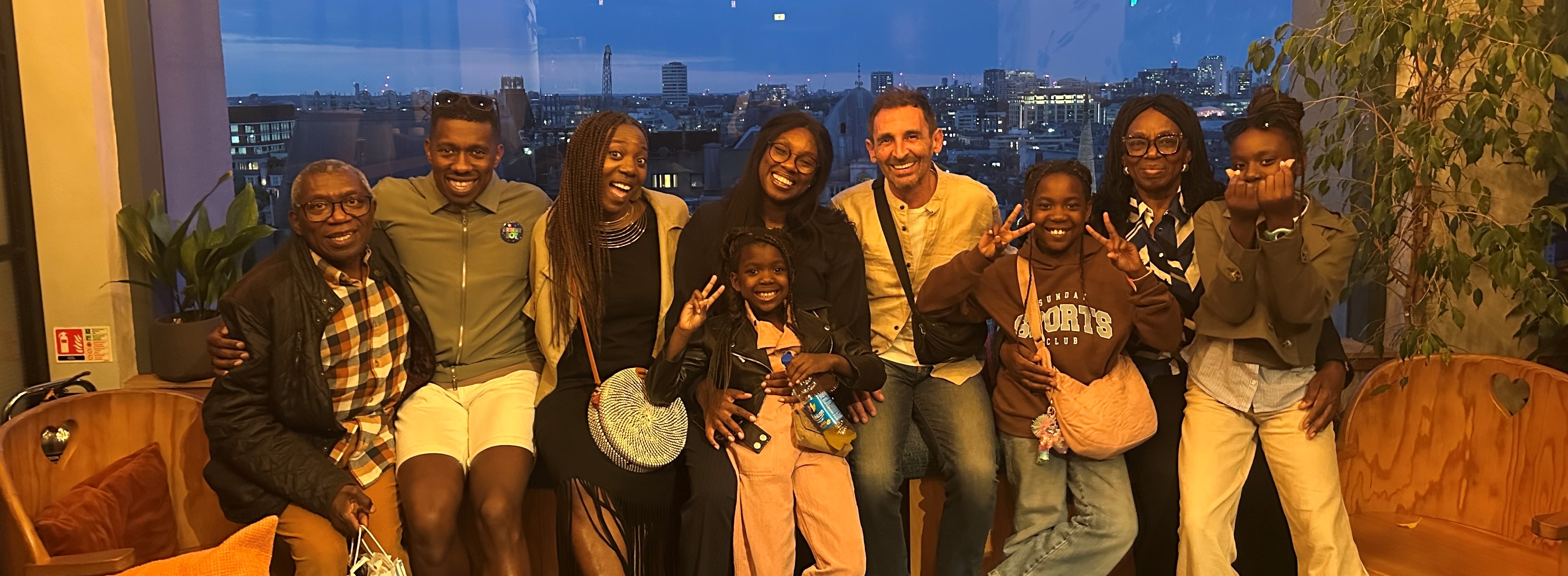 Extended family group photo with London skyline