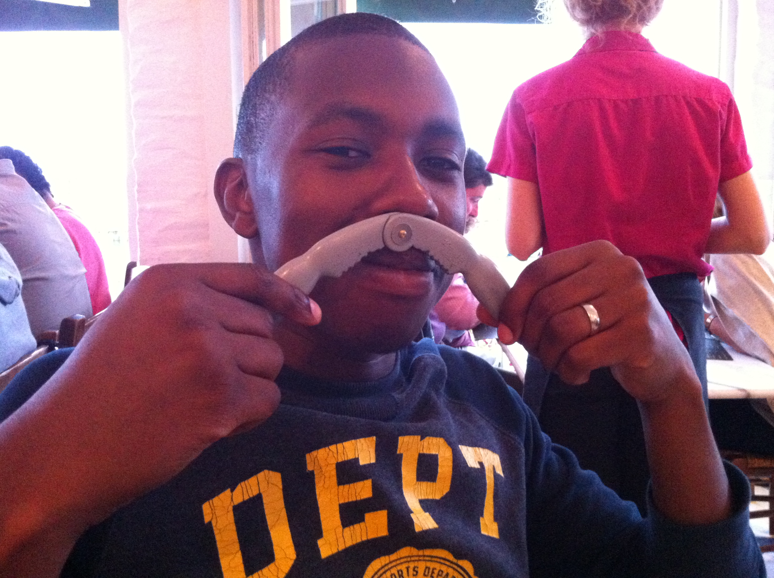 A younger John, playful moment at brunch