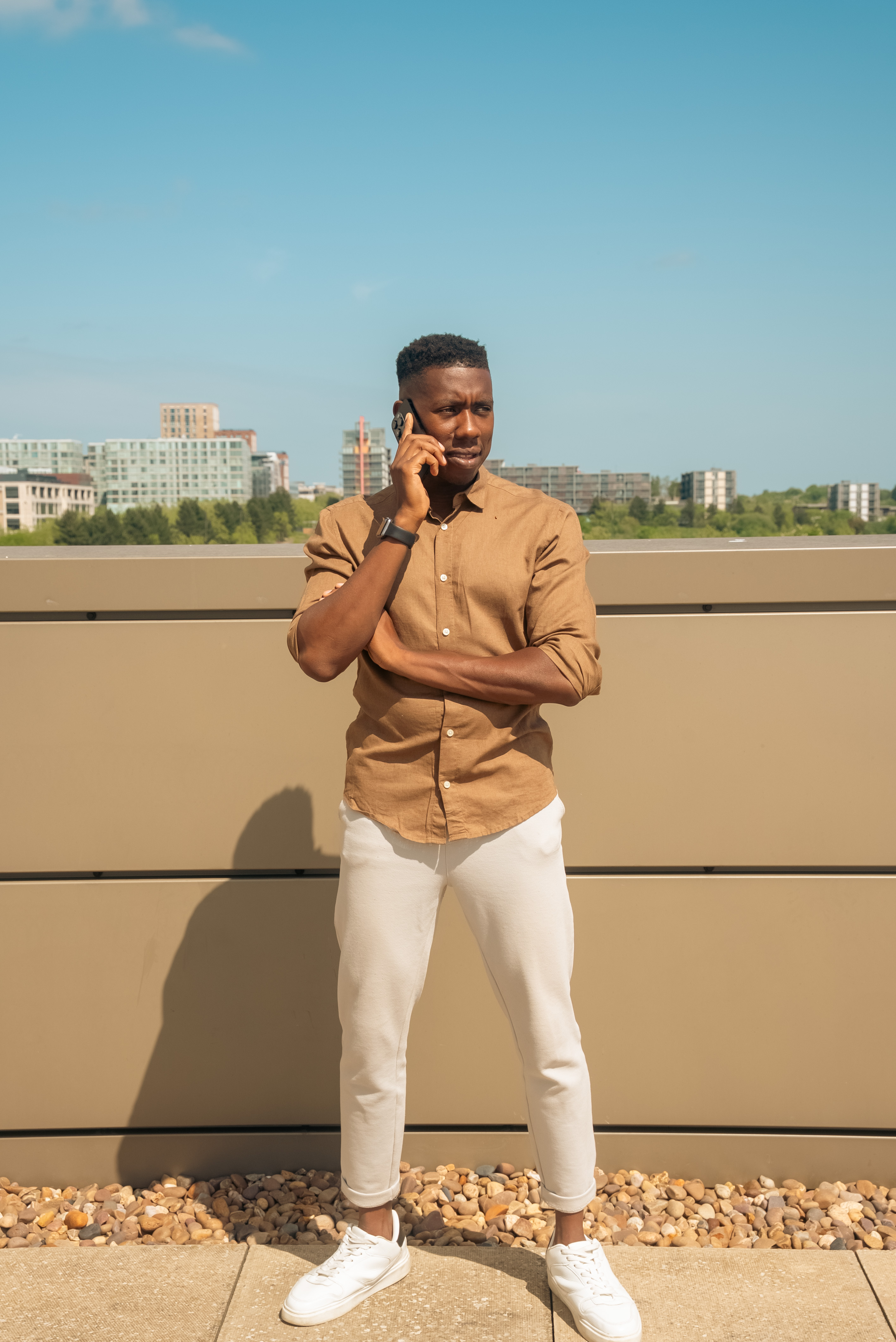 John on a rooftop phone call