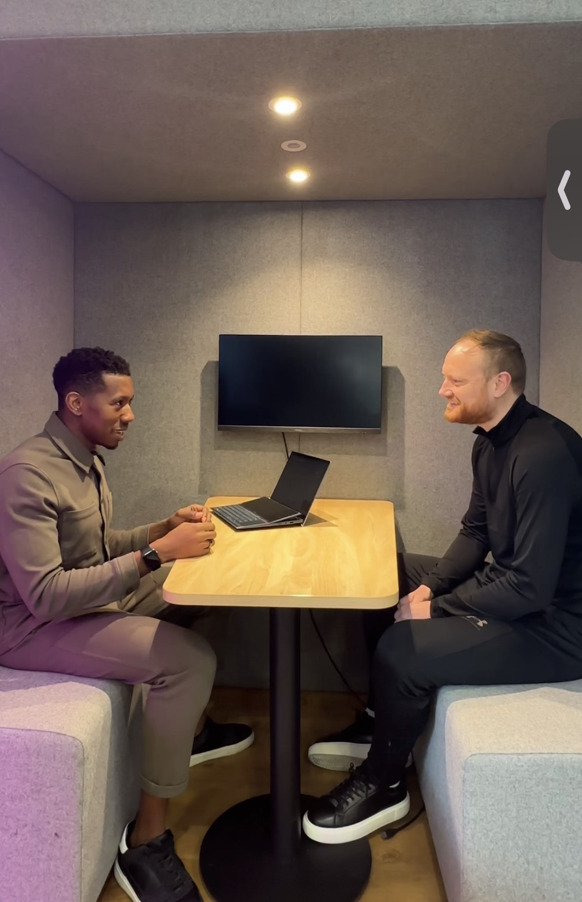 John in a coaching session with a client